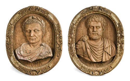 Lot 720 - A pair of relief carved oval wall panels of Roman emperors, 20th century