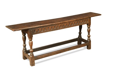 Lot 355 - A carved oak bench, 17th century