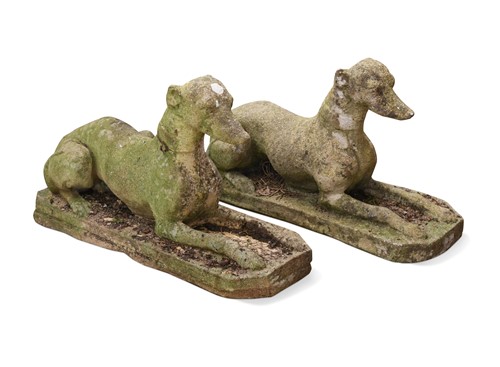 Lot 728 - A pair of reconstituted stone greyhounds, 20th century