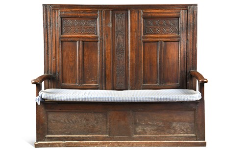 Lot 305 - A carved oak box seated settle, 18th century