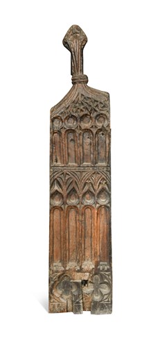 Lot 353 - A carved oak pew-end, 16th century