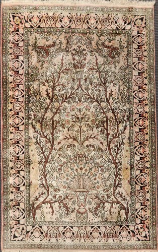 Lot 518 - A Persian tree of life silk rug, 154 x 92cm