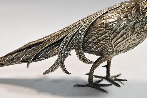 Lot 466 - Two mid 20th century Spanish metalwares silver table ornaments modelled as a brace of peacocks