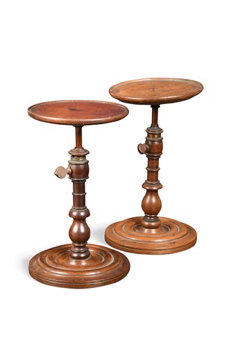 Lot 424 - A near pair of  mahogany candle stands, early 19th century