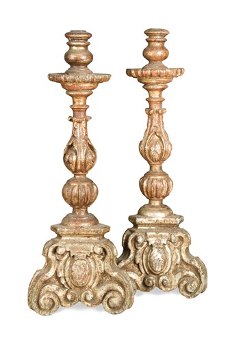 Lot 300 - A pair of Italian carved wood, gesso and silvered altar candlesticks, 18th/19th century