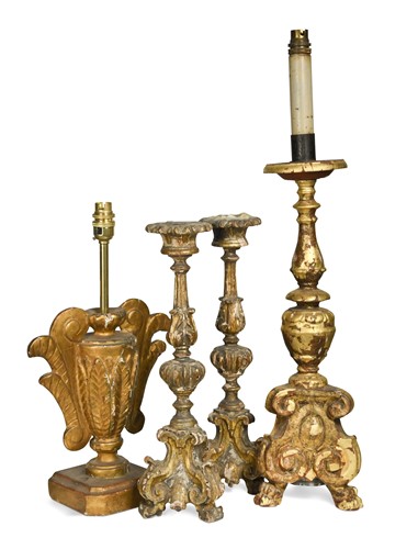 Lot 294 - A pair of Italian carved wood and gilded altar sticks, 18th century