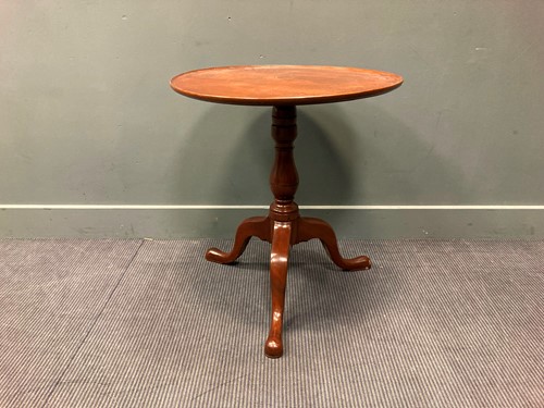 Lot 556 - A George III mahogany tripod table on fixed...