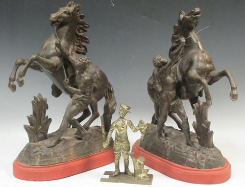 Lot 50 - A pair Marley horses on red painted wooden...