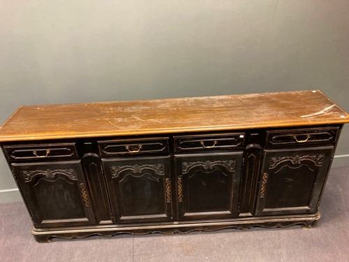 Lot 436 - A French black-painted carved wood dresser...