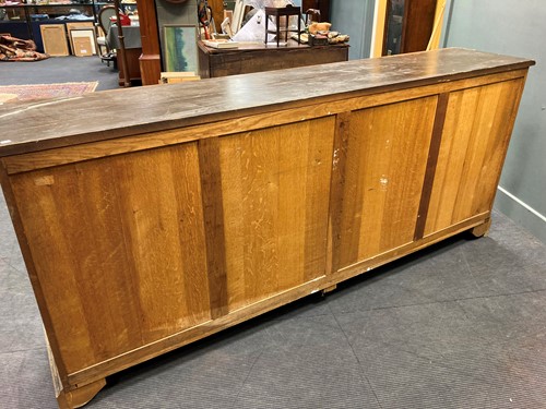 Lot 436 - A French black-painted carved wood dresser...