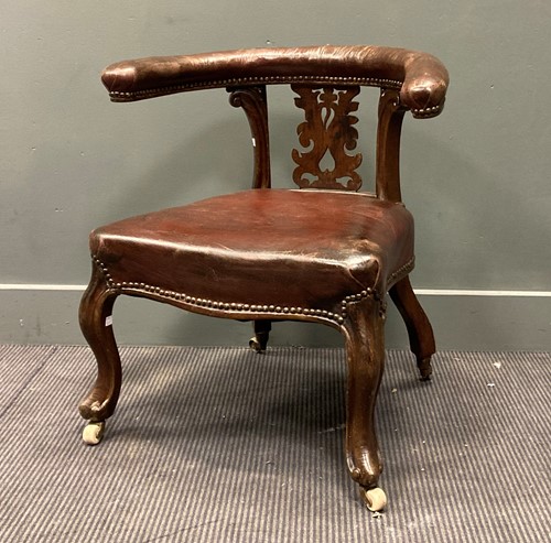 Lot 458 - A Victorian horseshoe shaped armchair with a...
