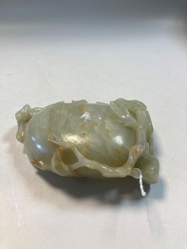 Lot 70 - A Chinese mutton fat jade ape and fruit bowl,  Qing Dynasty, 19th century