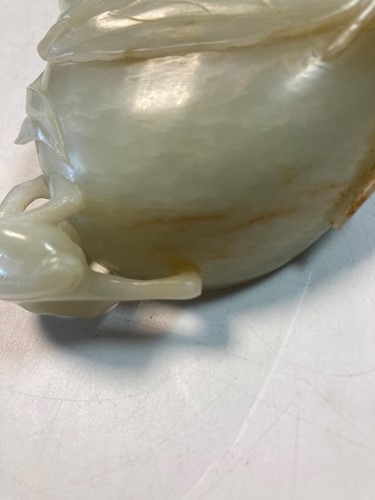 Lot 70 - A Chinese mutton fat jade ape and fruit bowl,  Qing Dynasty, 19th century