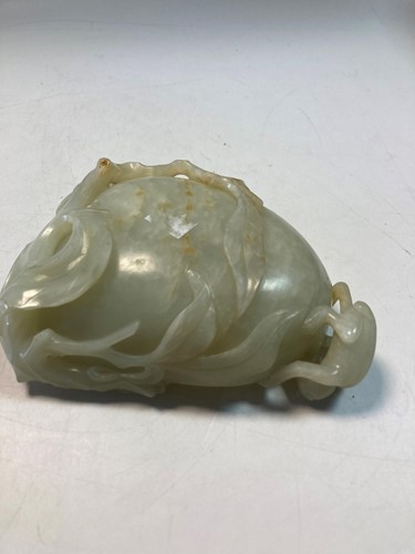 Lot 70 - A Chinese mutton fat jade ape and fruit bowl,  Qing Dynasty, 19th century