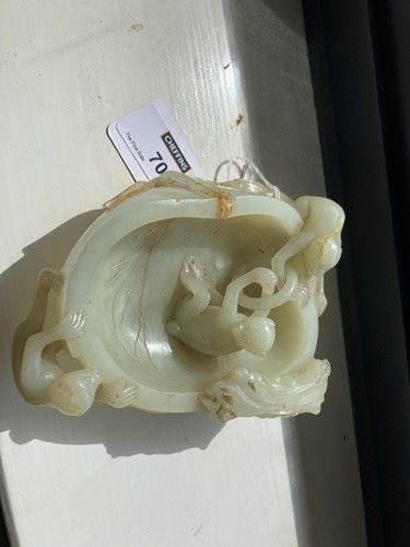 Lot 70 - A Chinese mutton fat jade ape and fruit bowl,  Qing Dynasty, 19th century