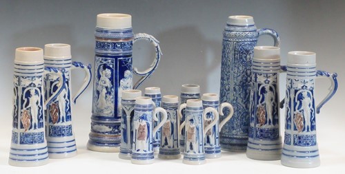 Lot 7 - A collection of Westerwald steins of varying...