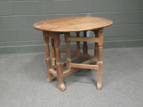 Lot 623 - An 18th century oak gateleg table, 71 x 91 x...