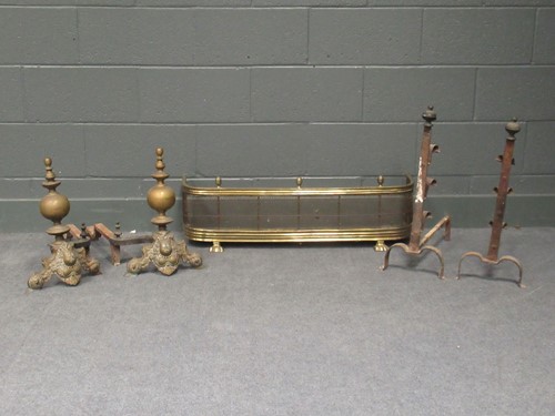 Lot 628 - Two pairs of andirons one brass in the Dutch...