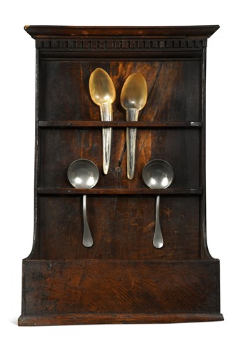 Lot 382 - A George III oak spoon rack