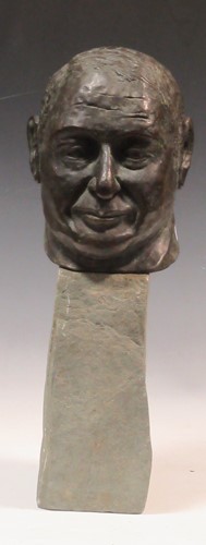 Lot 8 - A cast bronze bust of a gentleman on a stone...