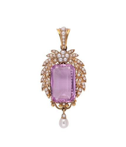 Lot 112 - An early 20th century pink topaz and split pearl pendant