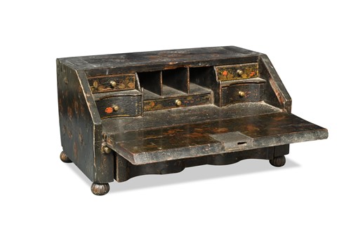 Lot 592 - A Chinoiserie decorated black lacquered table top bureau, early 18th century