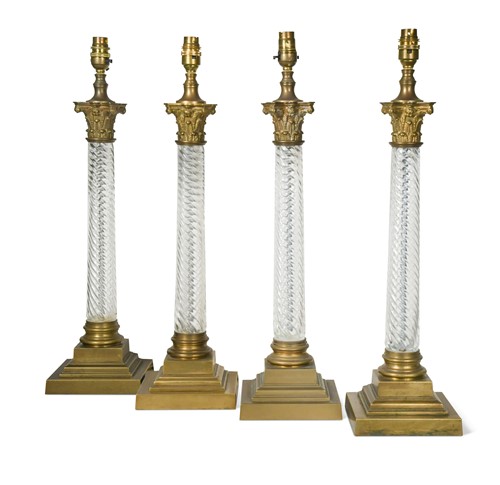 Lot 575 - A set of four glass column table lamps, 20th century