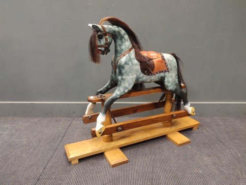 Lot 657 - A small rocking horse 83 x 107 x 43