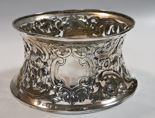 Lot 589 - An Edward VII silver dish ring together with a smaller Victorian English provincial example