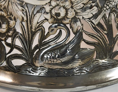 Lot 589 - An Edward VII silver dish ring together with a smaller Victorian English provincial example