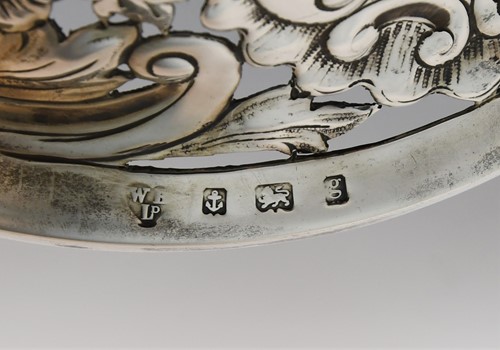 Lot 589 - An Edward VII silver dish ring together with a smaller Victorian English provincial example