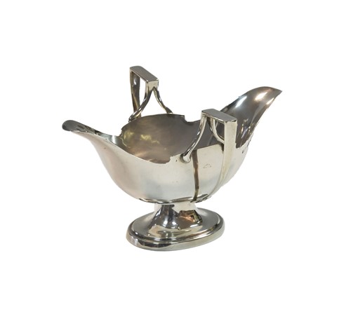 Lot 599 - A George V silver sauce boat of unusual design