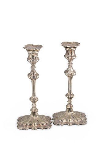 Lot 444 - A pair of late 19th century silver plated candlesticks