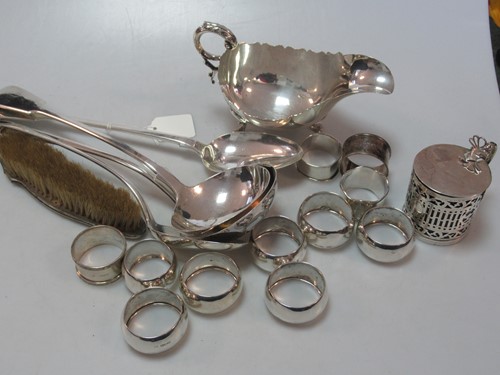 Lot 249A - A silver sauce boat, 11 silver napkin rings, a...