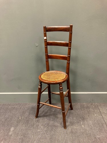 Lot 473 - A Victorian mahogany posture chair with caned...