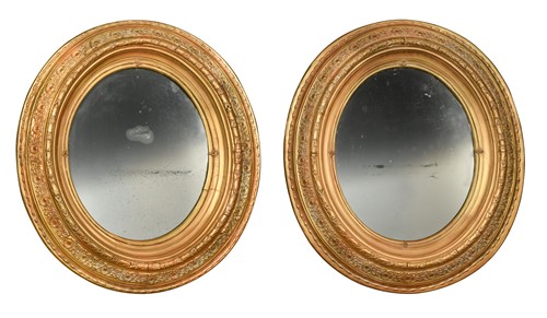 Lot 636 - A pair of oval gilt framed wall mirrors, 19th century