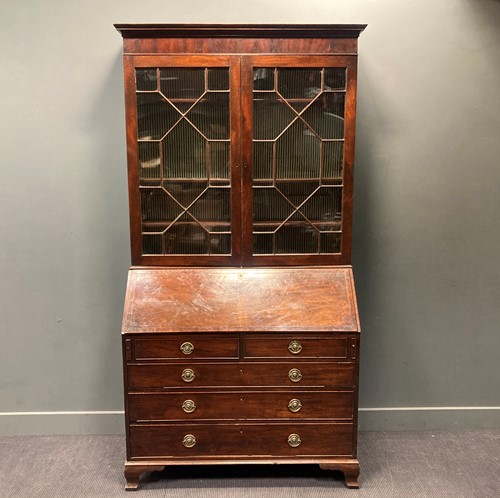 Lot 322 - A George III mahogany bureau bookcase
