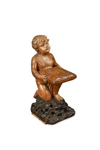 Lot 421 - A carved lime wood putti, probably 19th century