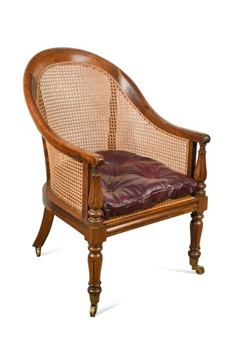 Lot 598 - A Regency rosewood caned library bergère armchair