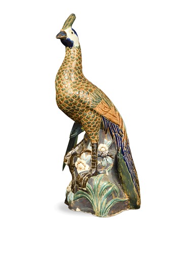 Lot 391 - A pottery peacock, possibly French