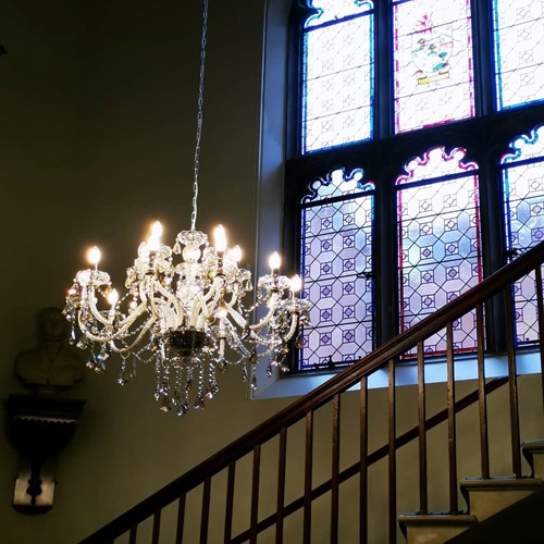 Lot 644 - A pair of cut and moulded glass fifteen light chandeliers, 20th century