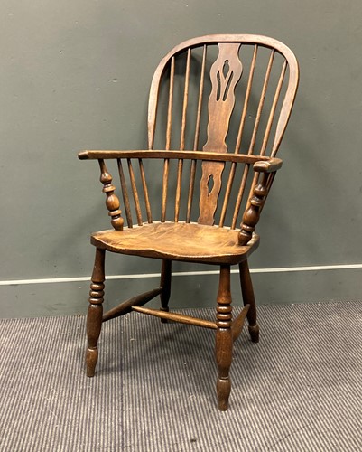 Lot 314 - A Victorian elm seated Windsor armchair, 100 x...