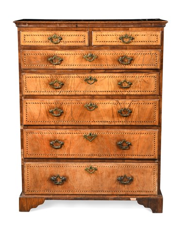 Lot 504 - A George III inlaid walnut chest of drawers