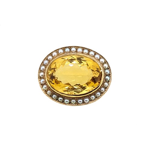 Lot 39 - A citrine and pearl target style brooch