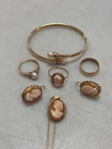 Lot 165 - A bangle tested as 9ct gold and a wedding band...