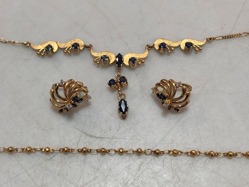 Lot 167 - A stone set necklace and earrings stamped '18K'...