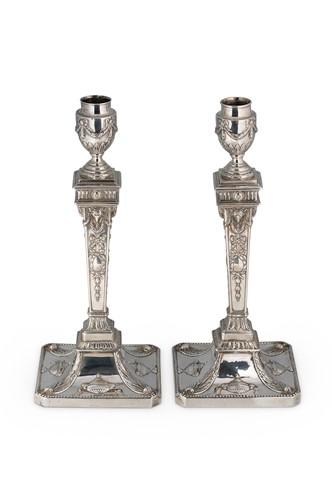 Lot 490 - A pair of George III 18th century silver candlesticks