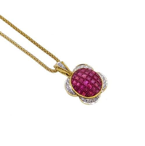 Lot 216 - A modern ruby and diamond pendant and chain