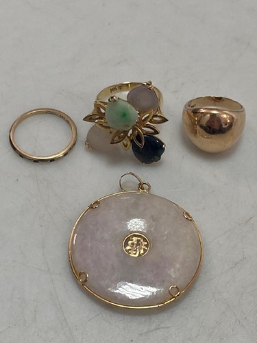 Lot 156 - A plain polished ring stamped '14K', together...
