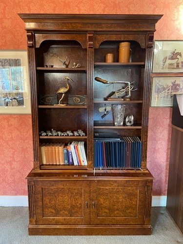 Lot 663 - An eight gun security cabinet disguised as a burr walnut bookcase by 21st Century Antiques